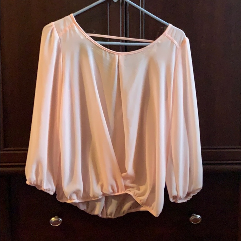 Sheer pink blouse with beaded back
